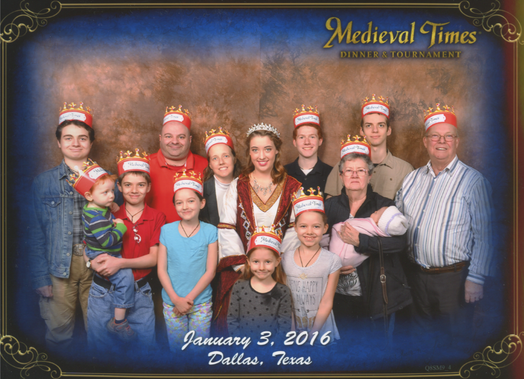 Medieval Times Stone Wall Background. Nunzio, Cross holding Becket, Papa, Jacinta, Jen, The Princess, Catie, Bernie, Michael, Grandmother 'Nana' holding Caterina, Joseph and Grandfather 'Pepere'. Bottom Text: 'Dallas, Texas January 3, 2016'